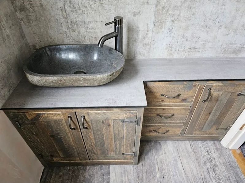 Reclaimed wood vanity unit with natural stone vessel basin