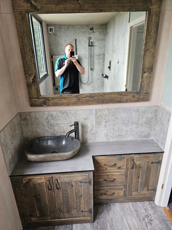 Rustic wood vanity with handcrafted mirror frame